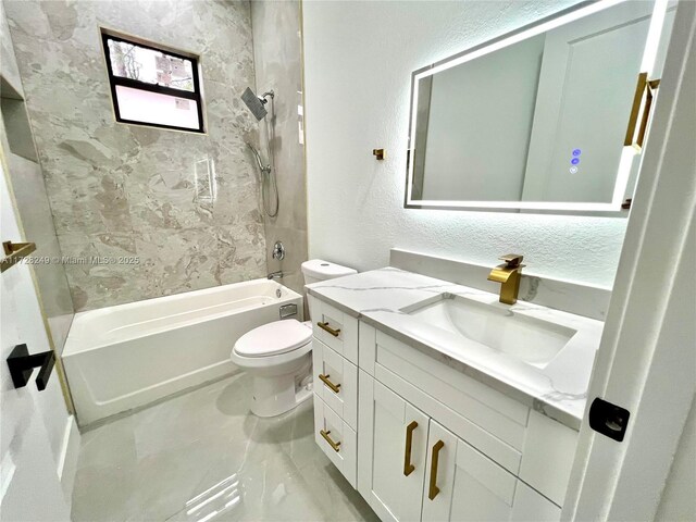 full bathroom featuring toilet, vanity, and tub / shower combination