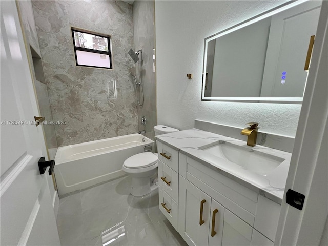 full bathroom featuring toilet, tiled shower / bath, and vanity