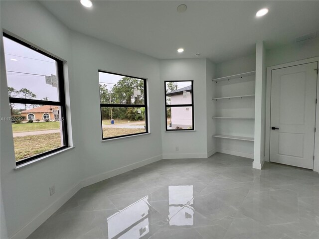 laundry area featuring tile patterned flooring, electric panel, washer hookup, electric dryer hookup, and cabinets