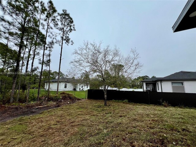 back of house featuring a yard