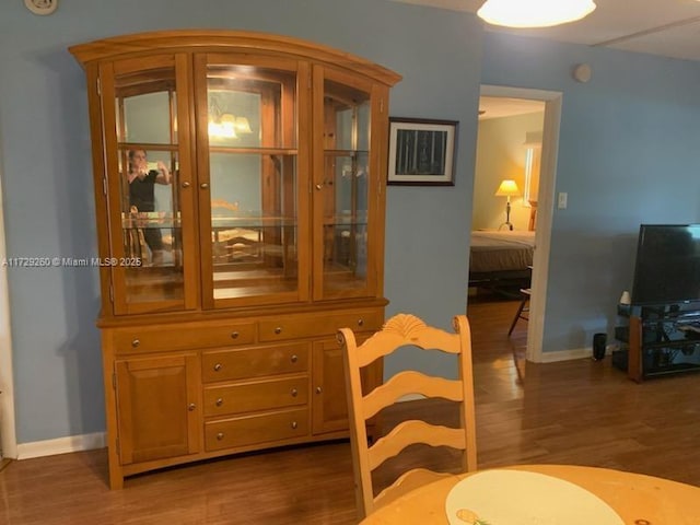 dining room with dark hardwood / wood-style floors