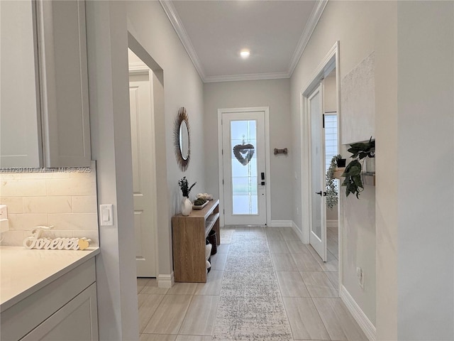 entryway featuring ornamental molding