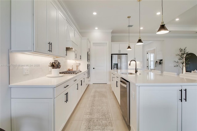 kitchen with a spacious island, pendant lighting, white cabinetry, and sink