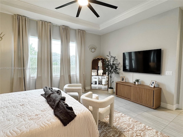 tiled bedroom featuring crown molding, a tray ceiling, and ceiling fan