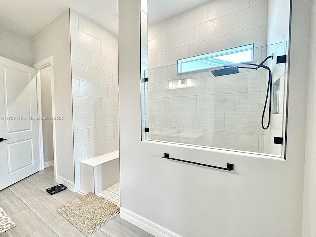 bathroom featuring tiled shower