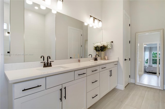 bathroom with vanity and tile patterned flooring