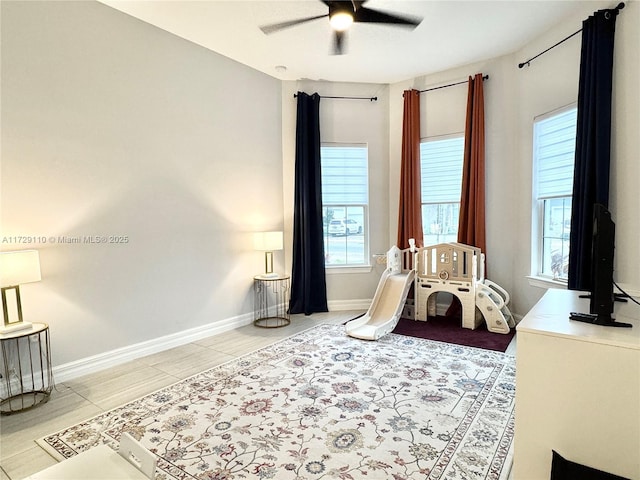 tiled bedroom with ceiling fan