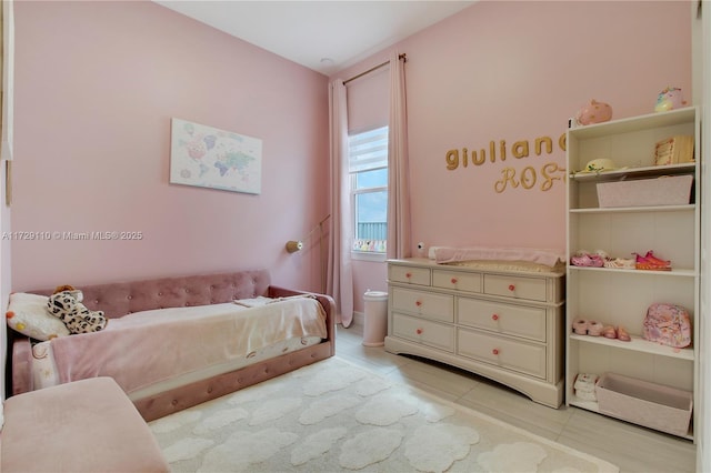 bedroom featuring light tile patterned floors