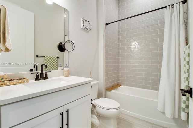 full bathroom featuring toilet, vanity, and shower / tub combo