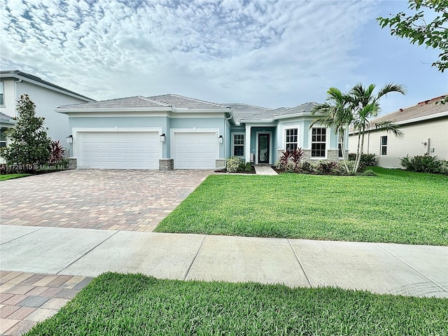 single story home with a garage and a front yard