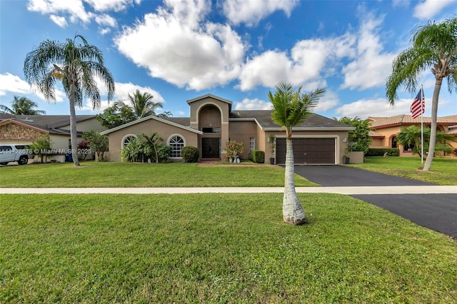 view of front of property featuring a garage and a front lawn