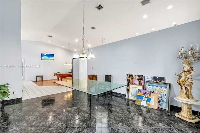 kitchen with pendant lighting and vaulted ceiling