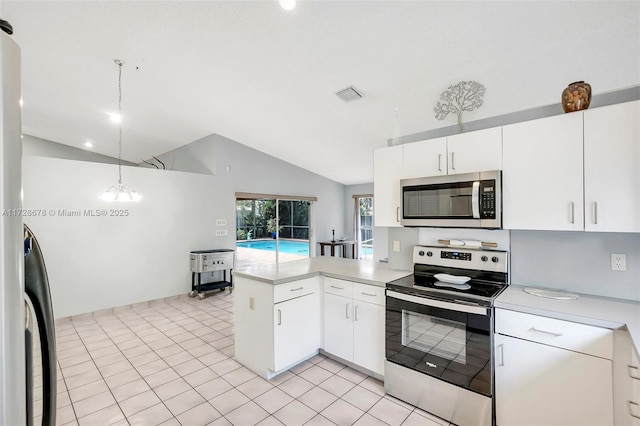 kitchen featuring pendant lighting, white cabinets, lofted ceiling, stainless steel appliances, and kitchen peninsula