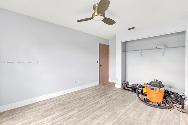 bedroom featuring a closet, ceiling fan, and light hardwood / wood-style floors