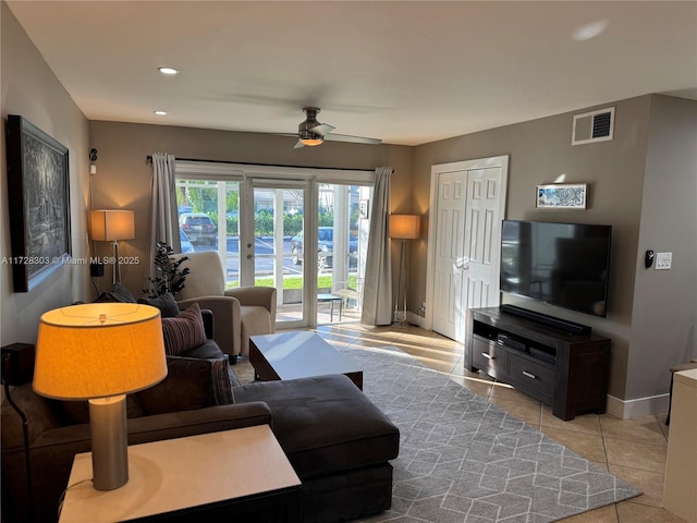 tiled living room featuring ceiling fan