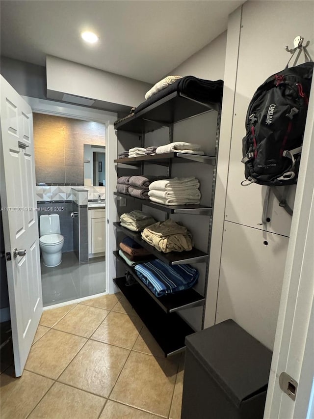 walk in closet featuring light tile patterned floors