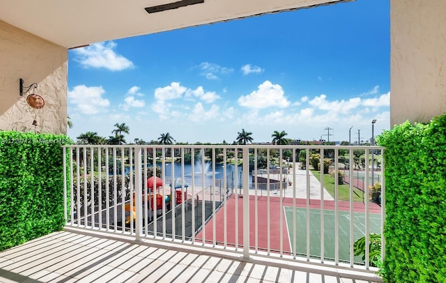 balcony featuring a water view