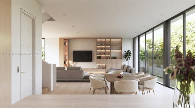 dining space with expansive windows and light hardwood / wood-style floors