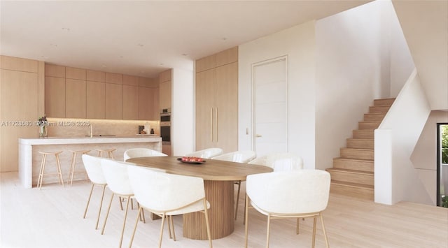 dining room with light hardwood / wood-style flooring