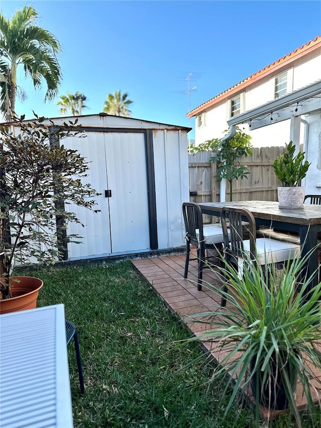 view of outbuilding with a yard