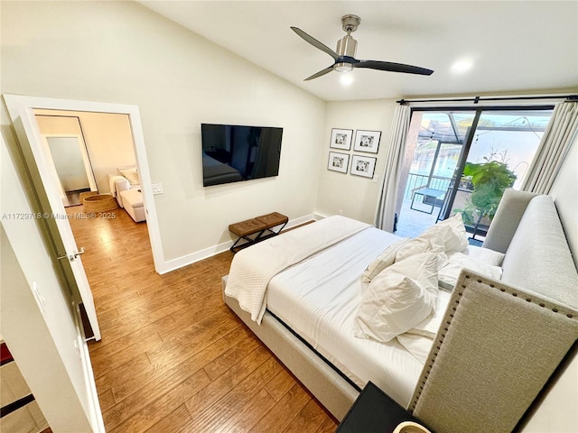 bedroom with ceiling fan, wood-type flooring, access to outside, and vaulted ceiling