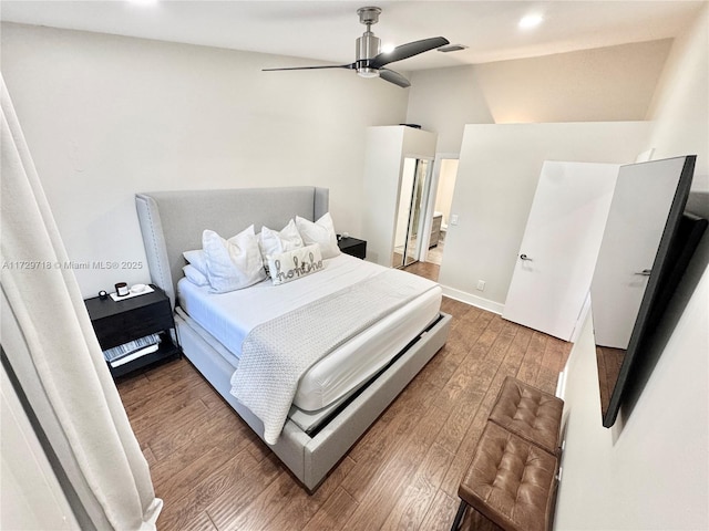 bedroom featuring ceiling fan and dark hardwood / wood-style flooring