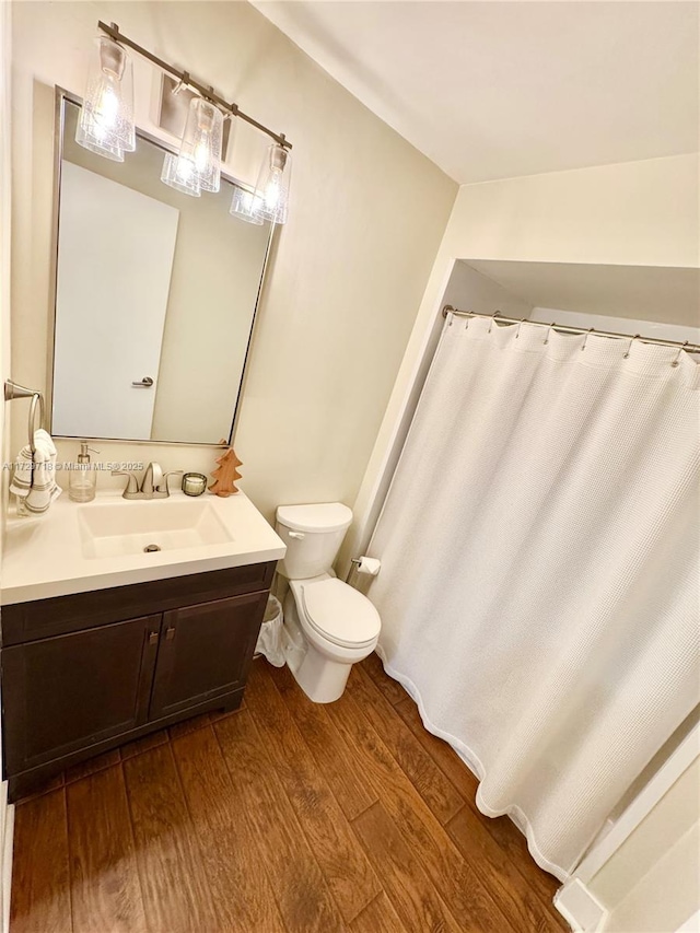 bathroom featuring hardwood / wood-style floors, toilet, and vanity