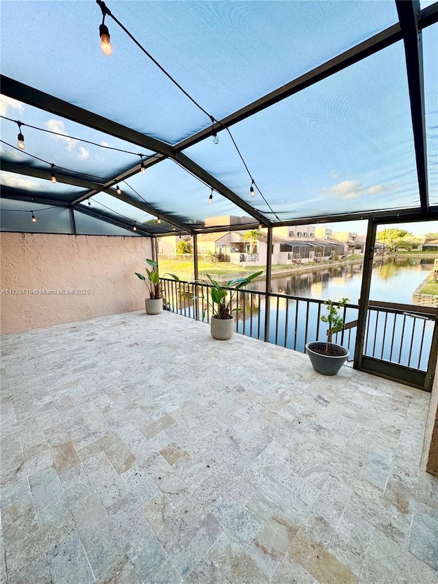 view of patio featuring a water view