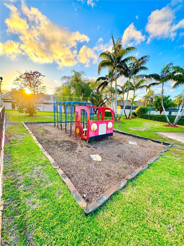 playground at dusk with a lawn