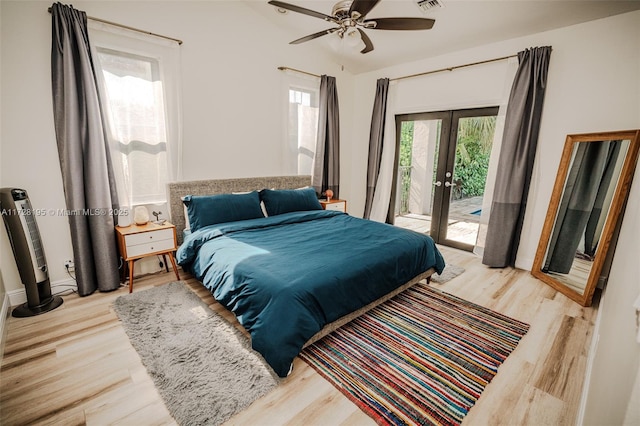 bedroom with access to exterior, french doors, ceiling fan, and light hardwood / wood-style flooring