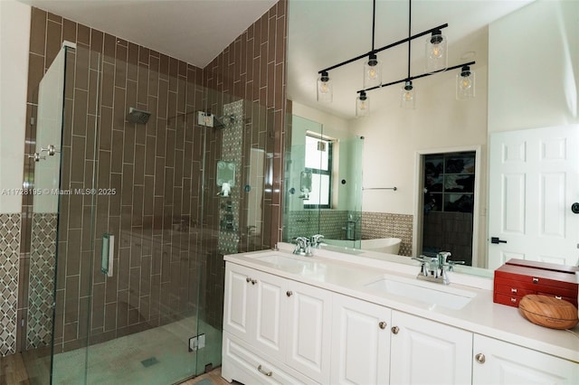 bathroom featuring vanity and an enclosed shower