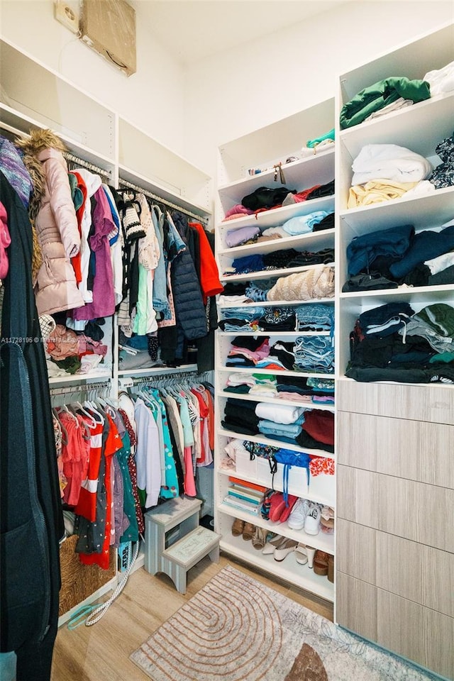 walk in closet featuring light hardwood / wood-style floors