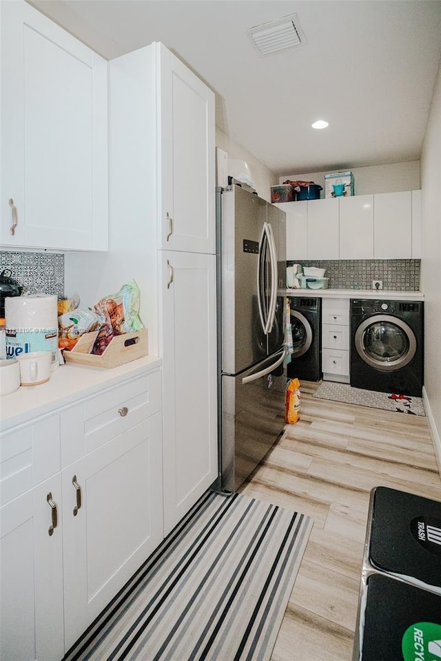 laundry room featuring light hardwood / wood-style flooring