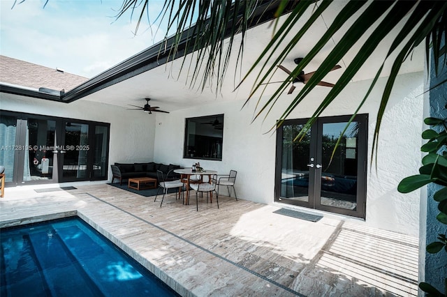 view of swimming pool featuring an outdoor hangout area, ceiling fan, and french doors