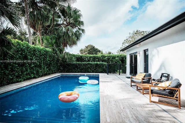 view of swimming pool featuring a patio