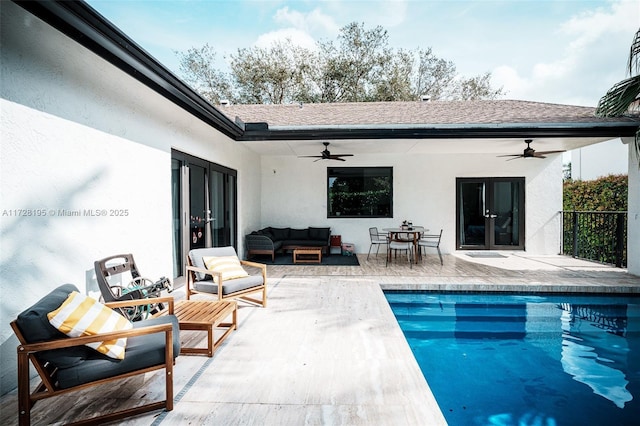 back of property with ceiling fan, a patio area, and outdoor lounge area