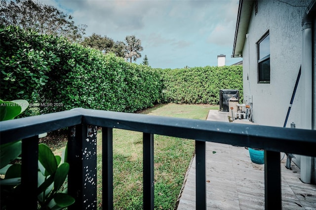 wooden terrace featuring a patio