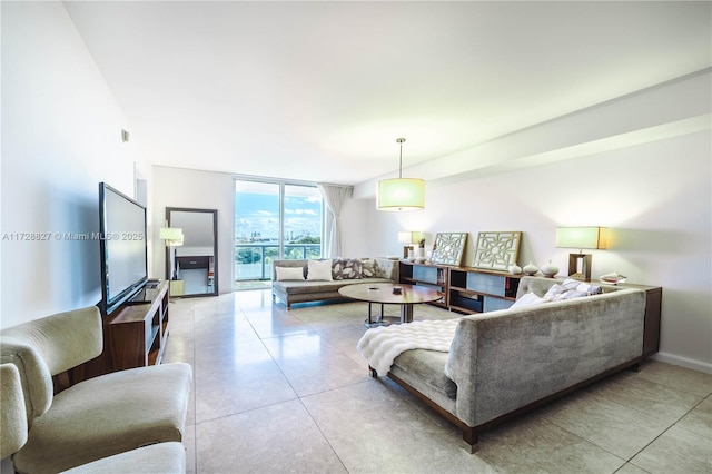 living room featuring floor to ceiling windows