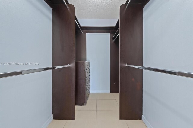 walk in closet featuring light tile patterned floors