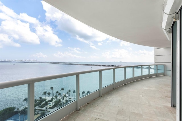 balcony featuring a water view