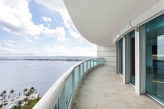 balcony featuring a water view