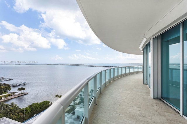 balcony featuring a water view