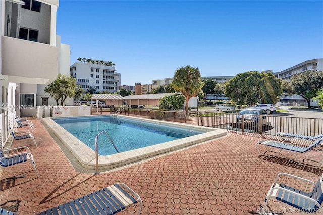 view of swimming pool with a patio area