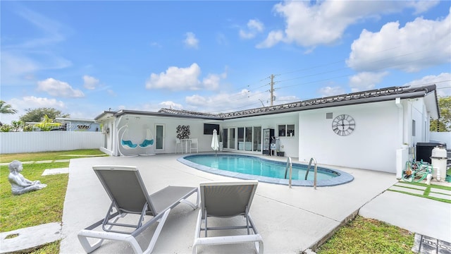 view of swimming pool featuring a patio area