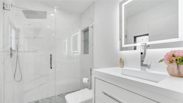 bathroom with a shower with door, toilet, and vanity