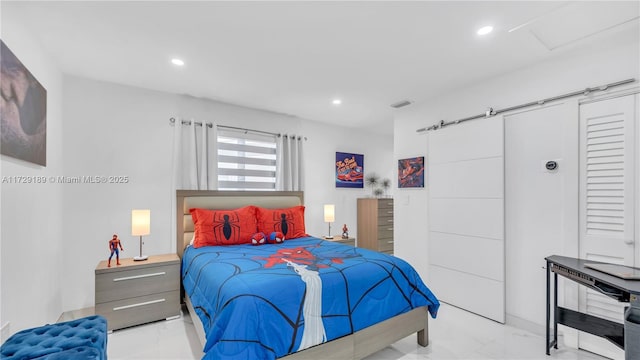 bedroom with a barn door