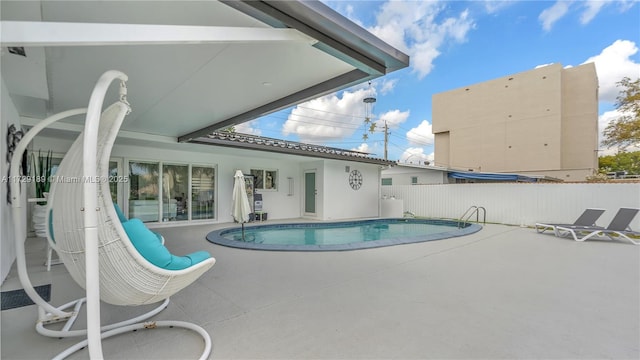 view of pool featuring a patio