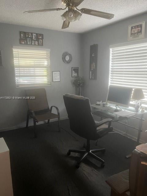 home office featuring a textured ceiling, ceiling fan, and plenty of natural light