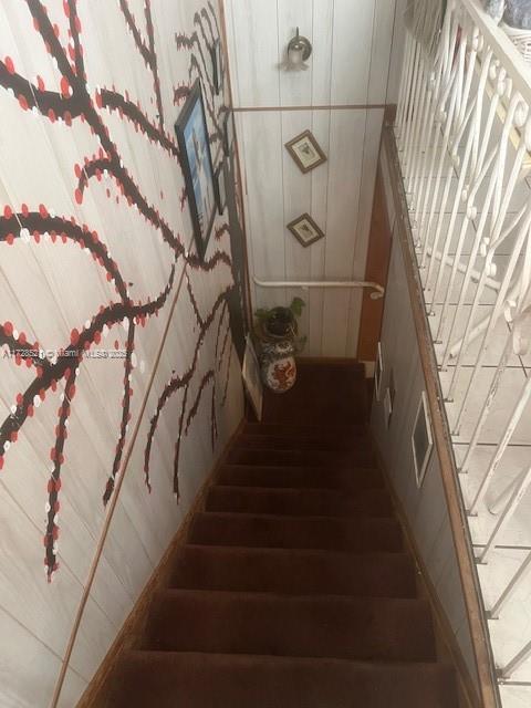 staircase featuring hardwood / wood-style floors