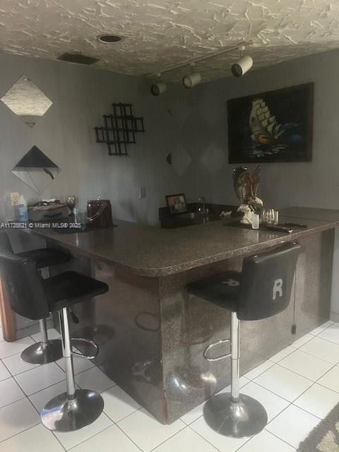 bar with light tile patterned floors